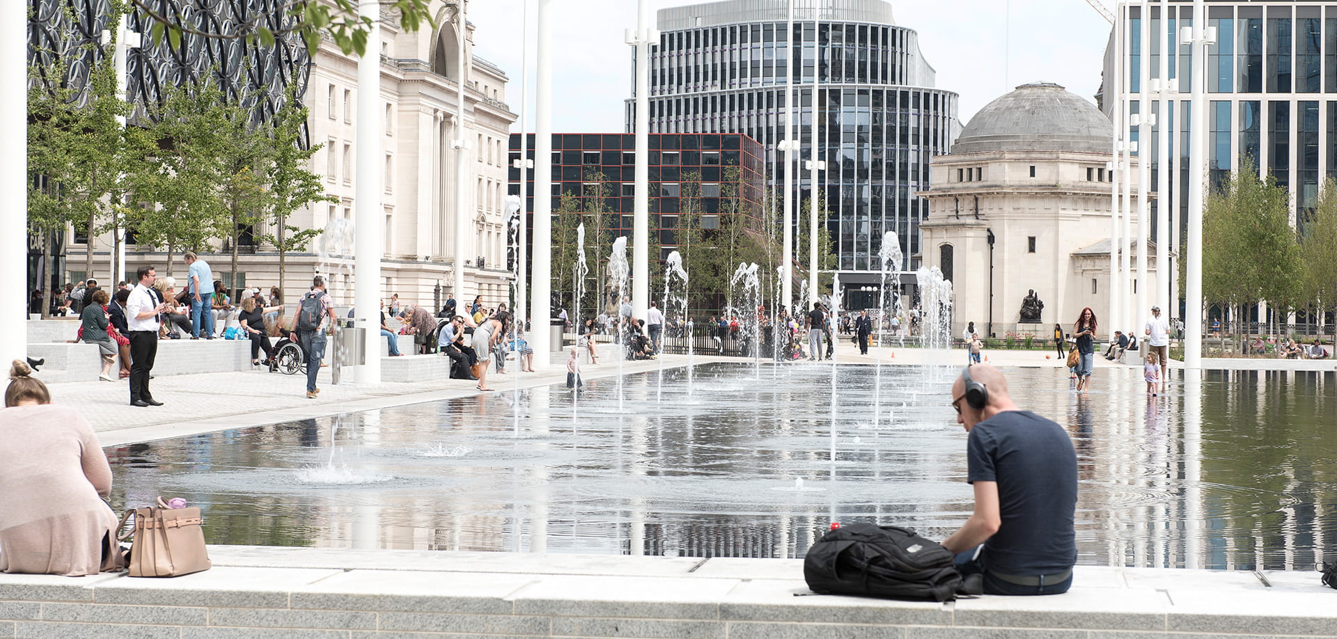 People gathered by the fountains at Centenary Square in Birmingham